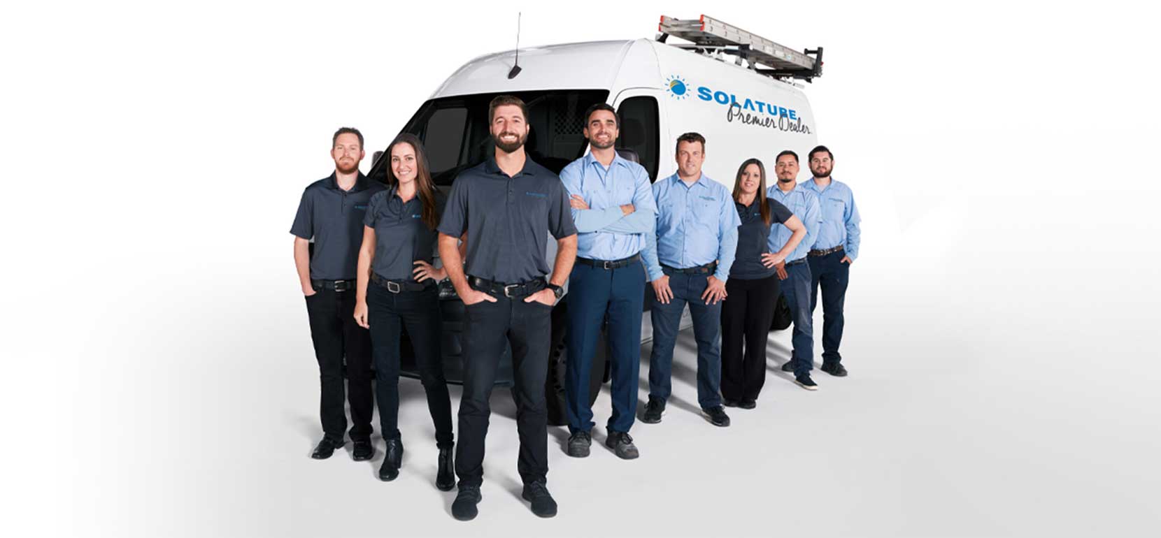 Team standing in front of truck